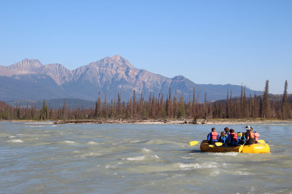 a group rafting down the Athabasca river one of the best activity to do in jasper