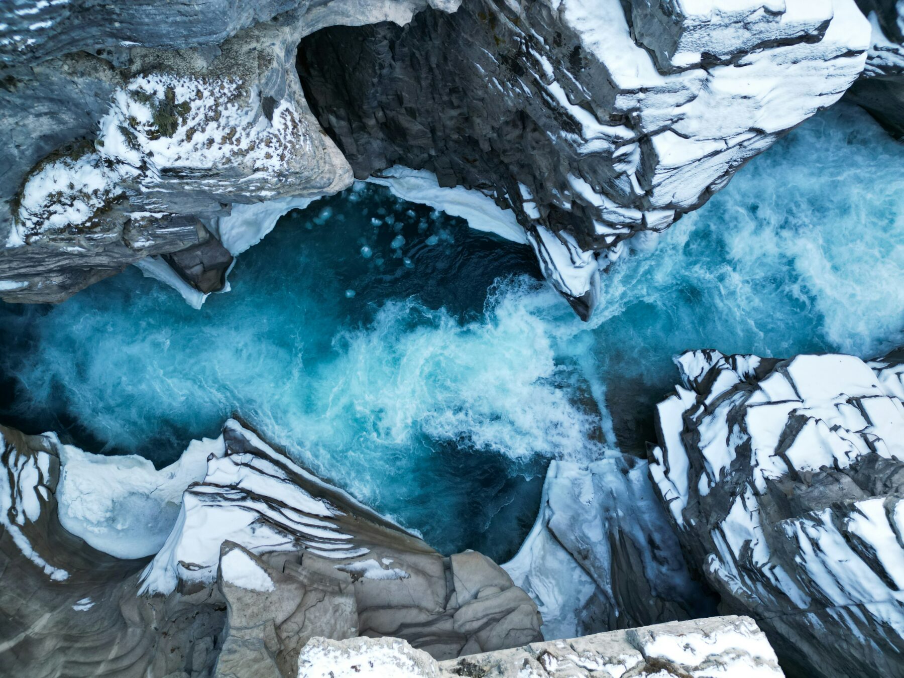 Paved viewing path overlooking a powerful waterfall in a mountain national park